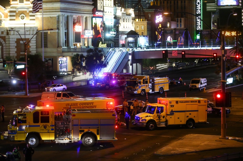 Las Vegas police and emergency vehicles sit on scene following a deadly shooting at a music festival on the Las Vegas Strip early Monday, Oct. 2, 2017. (Chase Stevens / Las Vegas Review-Journal)