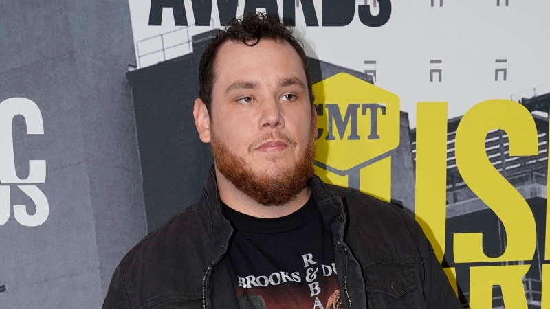 In this June 7, 2017 file photo, Luke Combs arrives at the CMT Music Awards in Nashville, Tenn. Combs took to social media to express his sadness after the mass shooting on Oct. 1 in Las Vegas at the Route 91 Harvest Festival. He performed earlier in the evening. (Sanford Myers / Invision / AP)