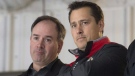 Ottawa Senators general manager Pierre Dorion and head coach Guy Boucher watch players skate during the second day of training camp Friday September 15, 2017 in Ottawa. (Adrian Wyld/THE CANADIAN PRESS)