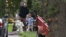 Joshua Boyle and one of his kids play in the garden at his parents house in Smiths Falls, Ont., on Saturday, Oct. 14, 2017. Canadian Joshua Boyle, his American wife Caitlan Coleman, and their three young children have been released after years held captive by a group that has ties to the Taliban and is considered a terrorist organization by the United States, U.S. and Pakistani officials said Thursday. THE CANADIAN PRESS/Lars Hagberg