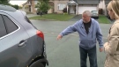 Gordan Scott shows the damage his car sustained after an alleged hit-and-run in Orleans, an Ottawa suburb. (CTV Ottawa)