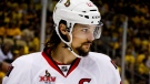 FILE - In this May 16, 2017, file photo, Ottawa Senators' Erik Karlsson prepares for a face-off during the second period of Game 2 of the Eastern Conference finals against the Pittsburgh Penguins, in Pittsburgh. Senators captain Erik Karlsson has no timetable to get back on the ice or play following offseason foot surgery. Karlsson, the runner-up for the Norris Trophy as the NHL‚Äôs top defenseman, says he hasn‚Äôt been able to do anything for three months since the operation in June to repair torn tendons in his left foot. (AP Photo/Gene J. Puskar, File)