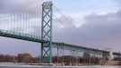 In a photo from Jan. 6, 2015 in Detroit, the Ambassador Bridge leading into Windsor, Ontario is seen from Detroit. (AP Photo/Carlos Osorio) 