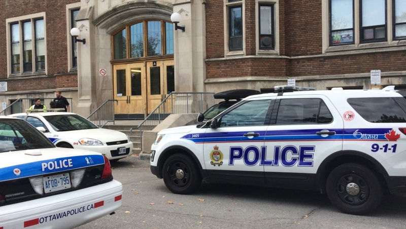 Ottawa Police outside Glebe Collegiate on Thursday, Oct. 19, 2017. Police arrested a young man after a bullet was found on the grounds.