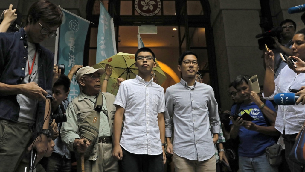 Joshua Wong, centre left, and Nathan Law