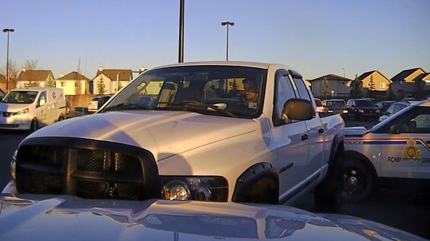 Two police vehicles were rammed by a stolen truck in the Walmart parking lot in Okotoks on October 2