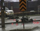 A motorcycle sits on its side after a street race turned bad in Ottawa's south end, Tuesday, April 28, 2009.