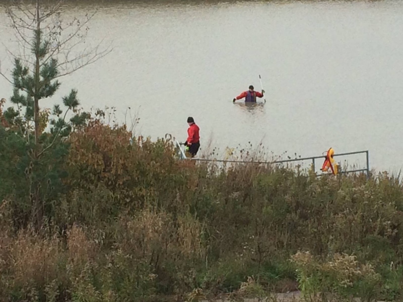 Police wade into a pond at Summerside searching for evidence in the Josie Glenn homicide case on Sunday, Oct. 29, 2017.
(Brent Lale / CTV London)

