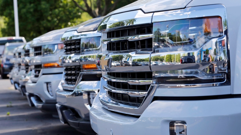 In this Wednesday, April 26, 2017, photo, Chevrolet trucks are lined up in lot at a Chevrolet dealership in Richmond, Va. (AP Photo/Steve Helber)
