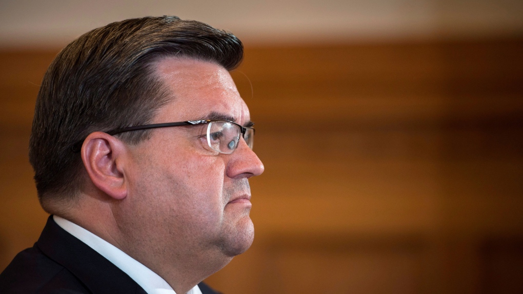 Former mayor Denis Coderre listens to a question during a news conference in Montreal on Wednesday, 