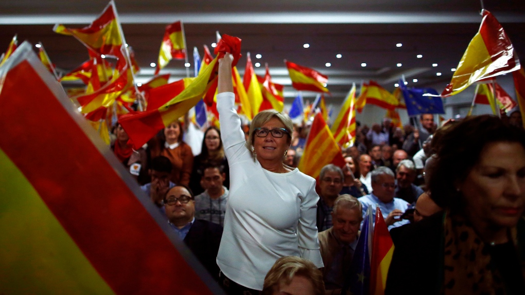 Participants wave Spanish flags