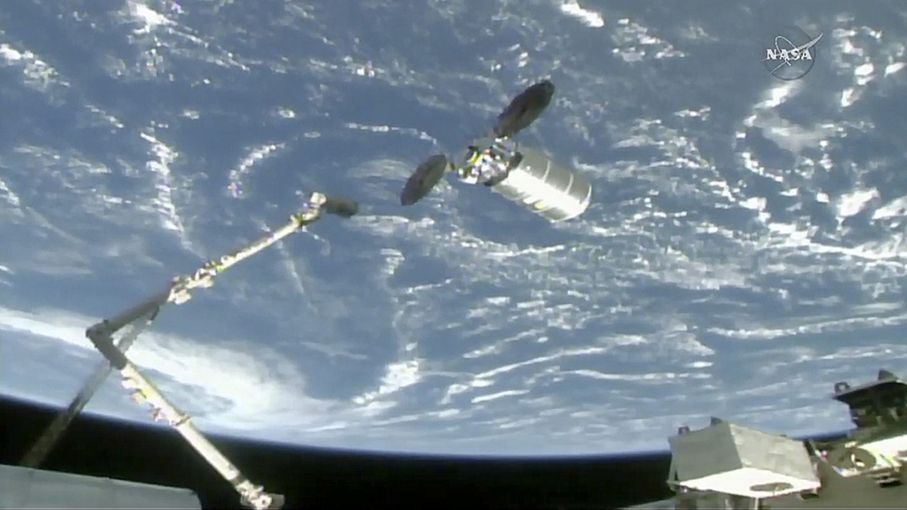 CanadArm reaches for the Cygnus cargo spacecraft