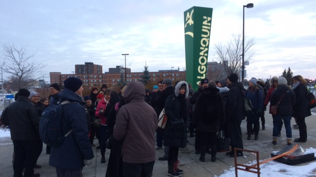 Algonquin College staff wait outside the college before returning to class on Monday, Nov. 20, 2017 after a five-week-long strike. 