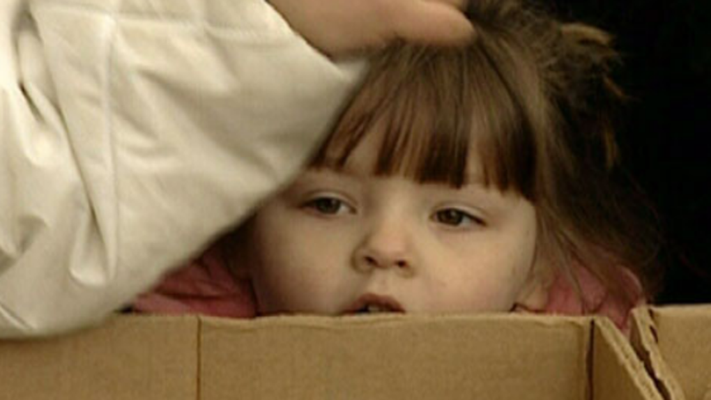 A child waits in line at a Vancouver food bank