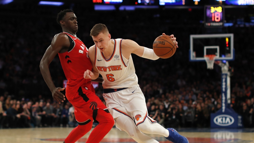 Brooklyn Nets' Shabazz Napier (13) drives past New York Knicks