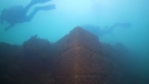 Divers investigate a fortress discovered at the bottom of Lake Van in Turkey. (YouTube / National Geographic)