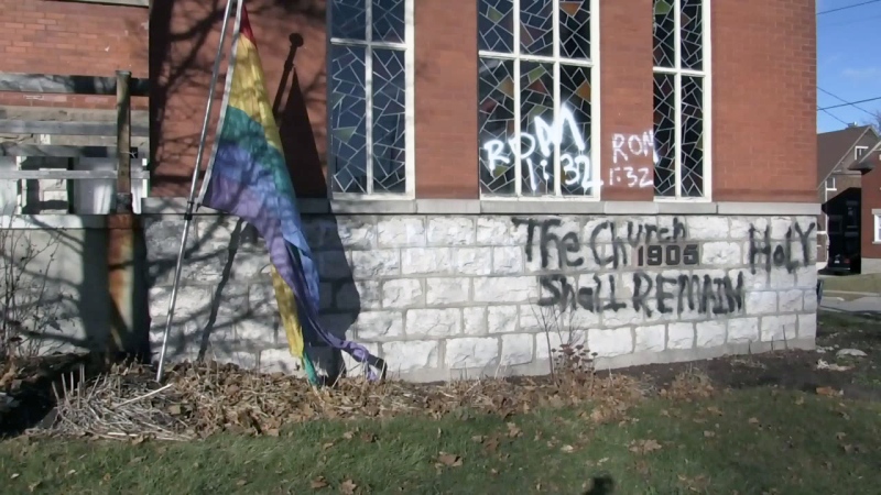 References to a Bible passage commonly perceived as being anti-homosexual were spray-painted next to a Pride flag at Emmanuel United Church in Waterloo.