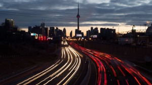 The headlights and tail lights of vehicles are shown as commuters travel into Toronto on the Gardiner Expressway in the early morning hours of Friday January 27, 2017. The Canadian Press has learned Ontario Premier Kathleen Wynne will deny the mayor of Toronto's request to impose tolls on two major highways. THE CANADIAN PRESS/Frank Gunn