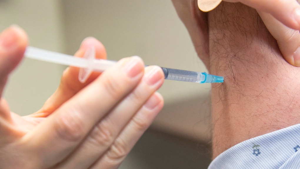 A flu vaccine is injected
