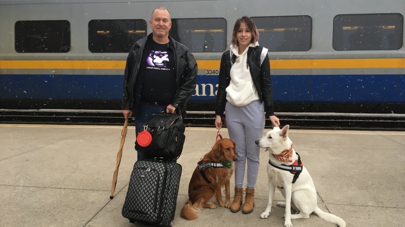 Emily Sadowski, her father Mark and two dogs head to Toronto on the Via Rail train in Windsor, Ont., Thursday, Dec. 7, 2017. (Chris Campbell / CTV Windsor) 