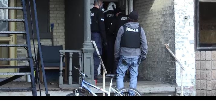 London police raid a home at Dundas and William Streets on Wednesday, Dec. 6, 2017.