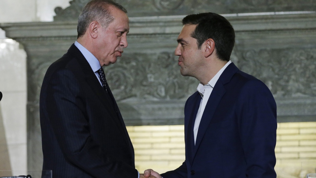 Tsipras, right, shakes hands with Erdogan