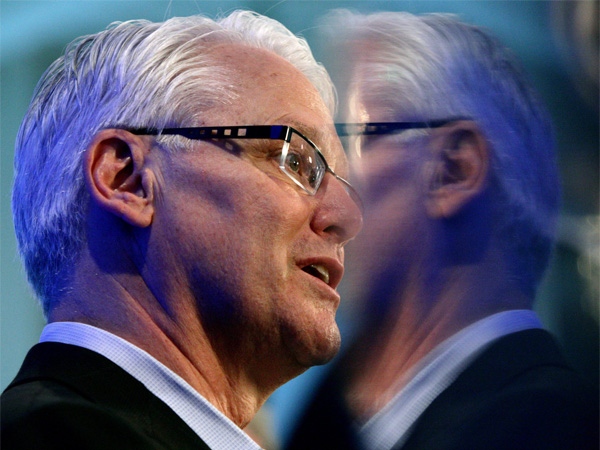 British Columbia Liberal Leader Gordon Campbell is reflected in the back of a photograph as he gives a speech after touring video game maker Electronic Arts in Burnaby, B.C., on Tuesday May 5, 2009. (THE CANADIAN PRESS/Darryl Dyck)