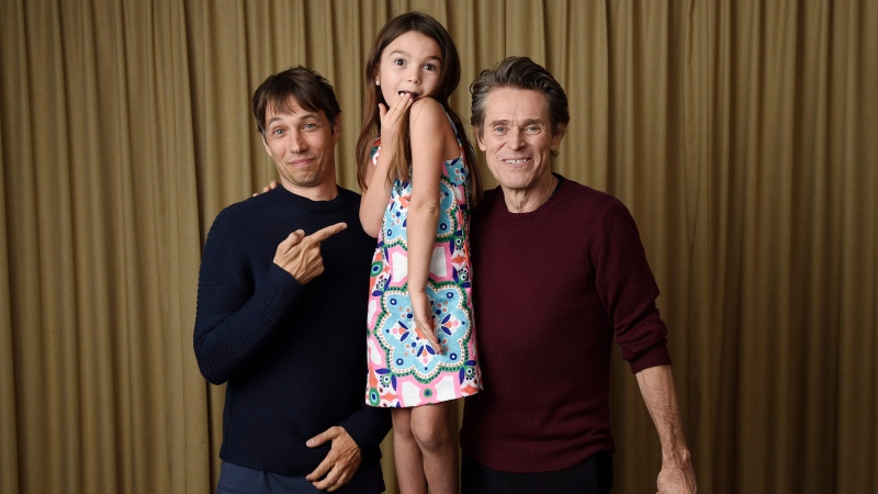 In this Sept. 9, 2017 photo, writer-director Sean Baker, from left, actress Brooklynn Prince and actor Willem Dafoe pose together to promote their film, "The Florida Project," during the Toronto International Film Festival in Toronto. (Photo by Chris Pizzello/Invision/AP)