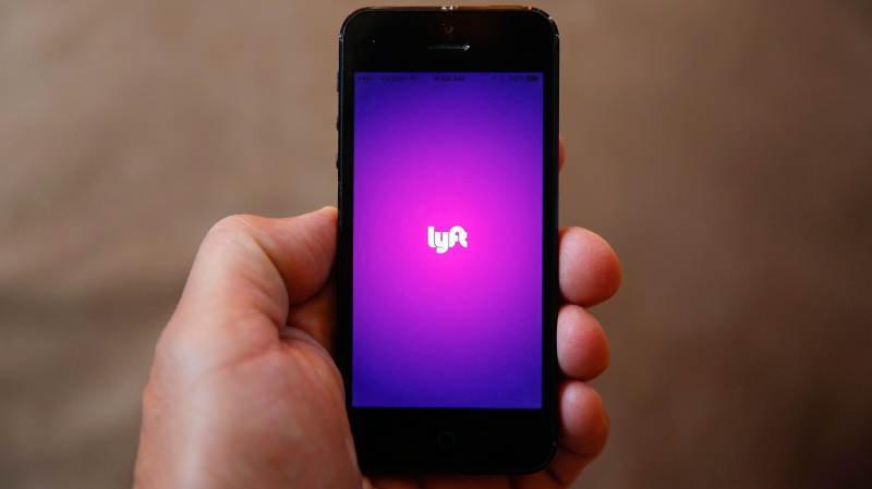This Monday, May 16, 2016, file photo shows a smartphone displaying the Lyft app, in Detroit. THE CANADIAn PRESS/AP-Paul Sancya