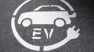 A electric vehicle charging sign is pictured in Squamish, B.C., on June, 1, 2016. (THE CANADIAN PRESS / Jonathan Hayward)