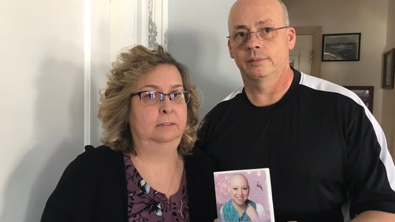 Brenda and Terence Roberts hold a picture of their late daughter, Kyra. She passed away in August at 25. They are looking for a missing USB stick with pictures of Kyra that was stolen from their van on Dec. 12, 2017 (Rich Garton / CTV Windsor)