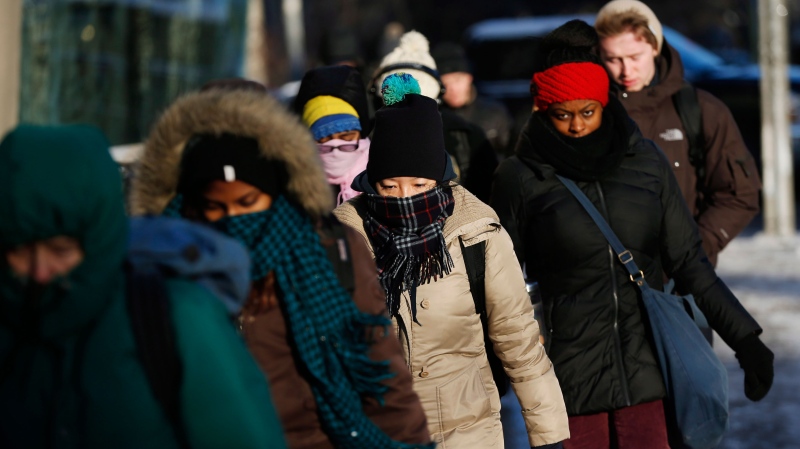 People make their way to work in Toronto during a deep freeze Tuesday, Jan. 7, 2014. (The Canadian Press/Mark Blinch) 