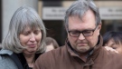 Clayton Babcock, right, stands next to his wife Linda as he reads a prepared statement outside court in Toronto on Saturday, December 16, 2017. THE CANADIAN PRESS/Chris Young