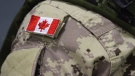 A Canadian flag patch is shown on a soldier's shoulder in Trenton, Ont., on Thursday, Oct. 16, 2014. THE CANADIAN PRESS/Lars Hagberg