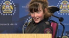 Erin Donaldson, 11, takes to the podium in the CPS media centre as part of her officer-for-a-day experience