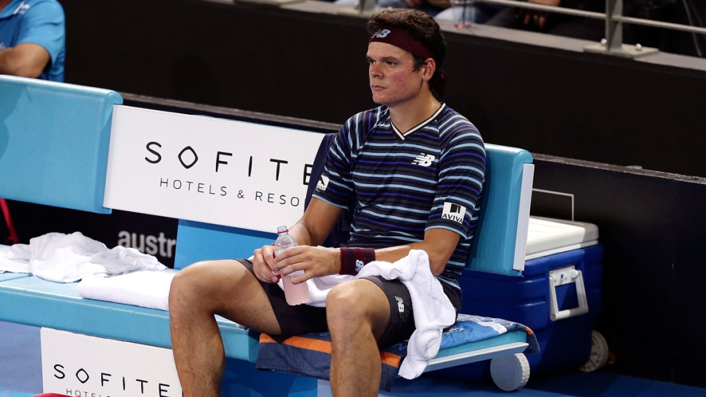Milos Raonic looks dejected after a loss