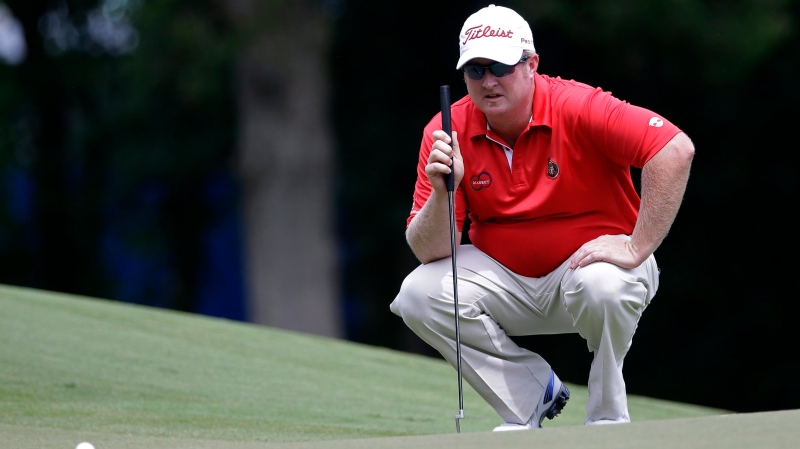 Brad Fritsch, of Canada, lines up a putt on the first green during the final round of the Wyndham Championship golf tournament in Greensboro, N.C., Sunday, Aug. 17, 2014. (Gerry Broome/AP Photo)