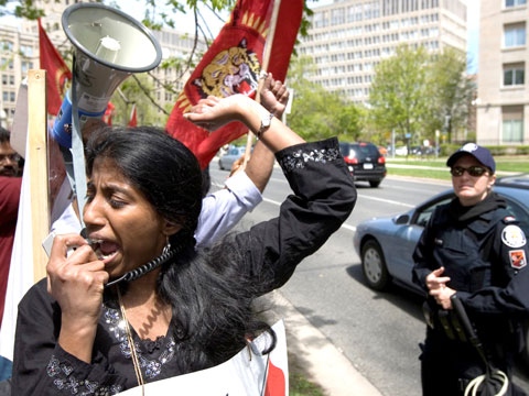 A Tamil protester shouts into a megaphone at Queen`s Park in Toronto on Wednesday May 13, 2009. (Darren Calabrese / THE CANADIAN PRESS)