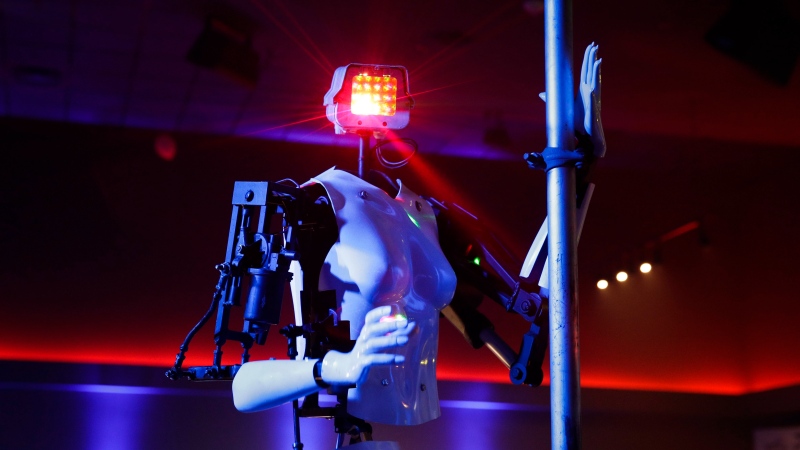 A pole-dancing robot built by British artist Giles Walker performs at a gentlemen's club Monday, Jan. 8, 2018, in Las Vegas. (AP Photo/Jae C. Hong)