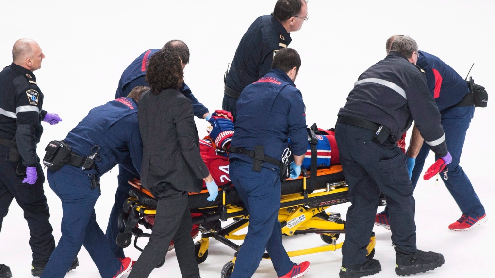 Montreal Canadiens' Phillip Danault on stretcher