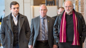 Train driver Thomas Harding, centre, leaves the courtroom with his lawyers Tom Walsh, right, and Charles Shearson, left, after a question from the jury on the fifth day of deliberations, Monday, Jan. 15, 2018 in Sherbrooke, Que. (Ryan Remiorz / THE CANADIAN PRESS)