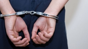 A pair of handcuffs are seen in this file image.