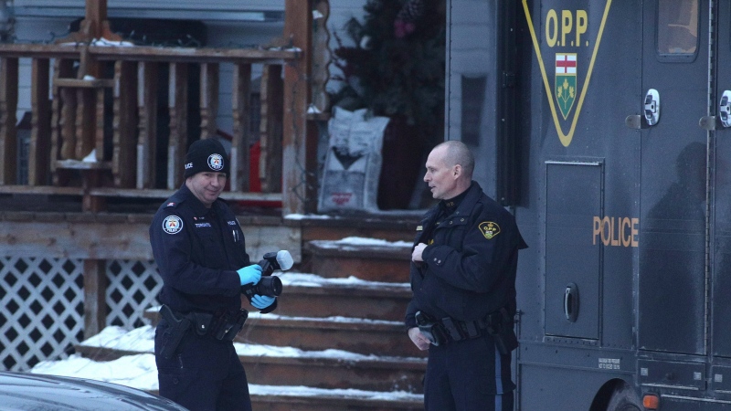 Forensic police officers from the OPP and the Toronto police service stand outside a residence linked to Bruce McArthur in Madoc, Ont., on Friday January 19, 2018. (THE CANADIAN PRESS/Lars Hagberg)