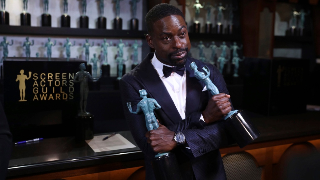 Sterling K. Brown poses with his SAG awards