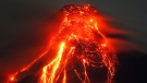 Mayon volcano spews molten lava during its sporadic eruption early Thursday, Jan. 25, 2018 as seen from a village in Legazpi city, Albay province, around 340 kilometres southeast of Manila, Philippines. (AP / Bullit Marquez)