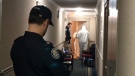 Officers stand in the hallway outside alleged serial killer Bruce McArthur's apartment in January 2018. (CP24)
