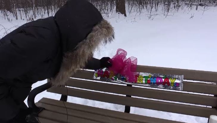 Tasha, the sister of Shelley Desrochers, decorates a bench on Shelley's 44rd birthday on Sunday, Feb. 4, 2018.
