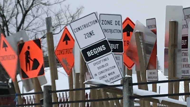 A cluster of road construction signs in Ottawa, Ont. 