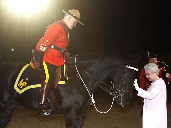 Police Service Horse (PSH) George is patted by Queen Elizabeth II after a presentation by the RCMP at the Windsor Castle Royal Tattoo in Windsor, England, on Saturday evening May 16, 2009. (AP / PA, Steve Parsons)