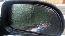 Freezing rain has left a glaze on a car's rearview mirror in this undated file photo.